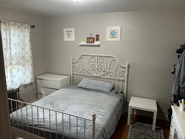a bedroom with two beds and a table