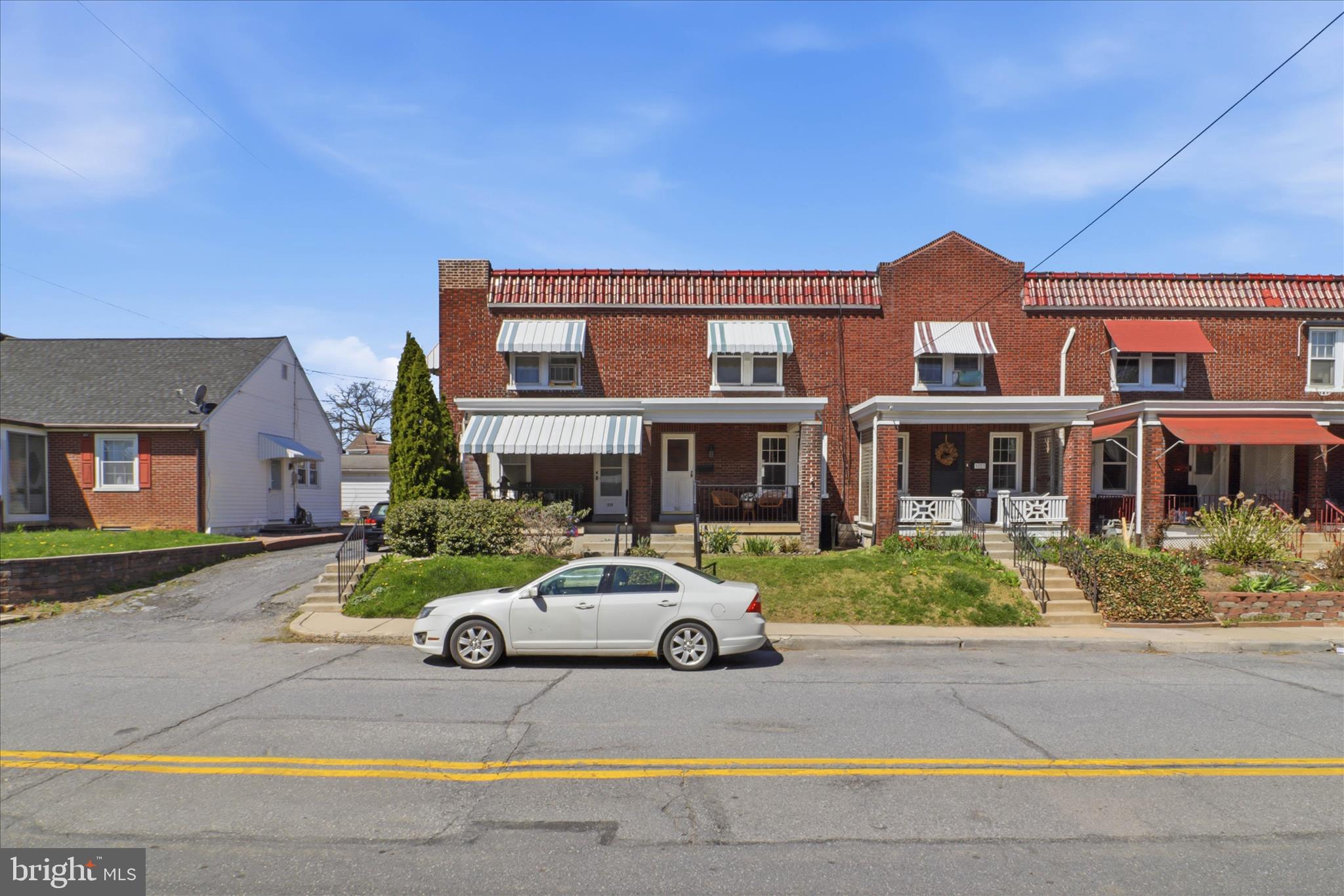 521 Hamilton Street Lancaster, PA 17602 - Photo 2 of 44 a car parked in front of a brick house