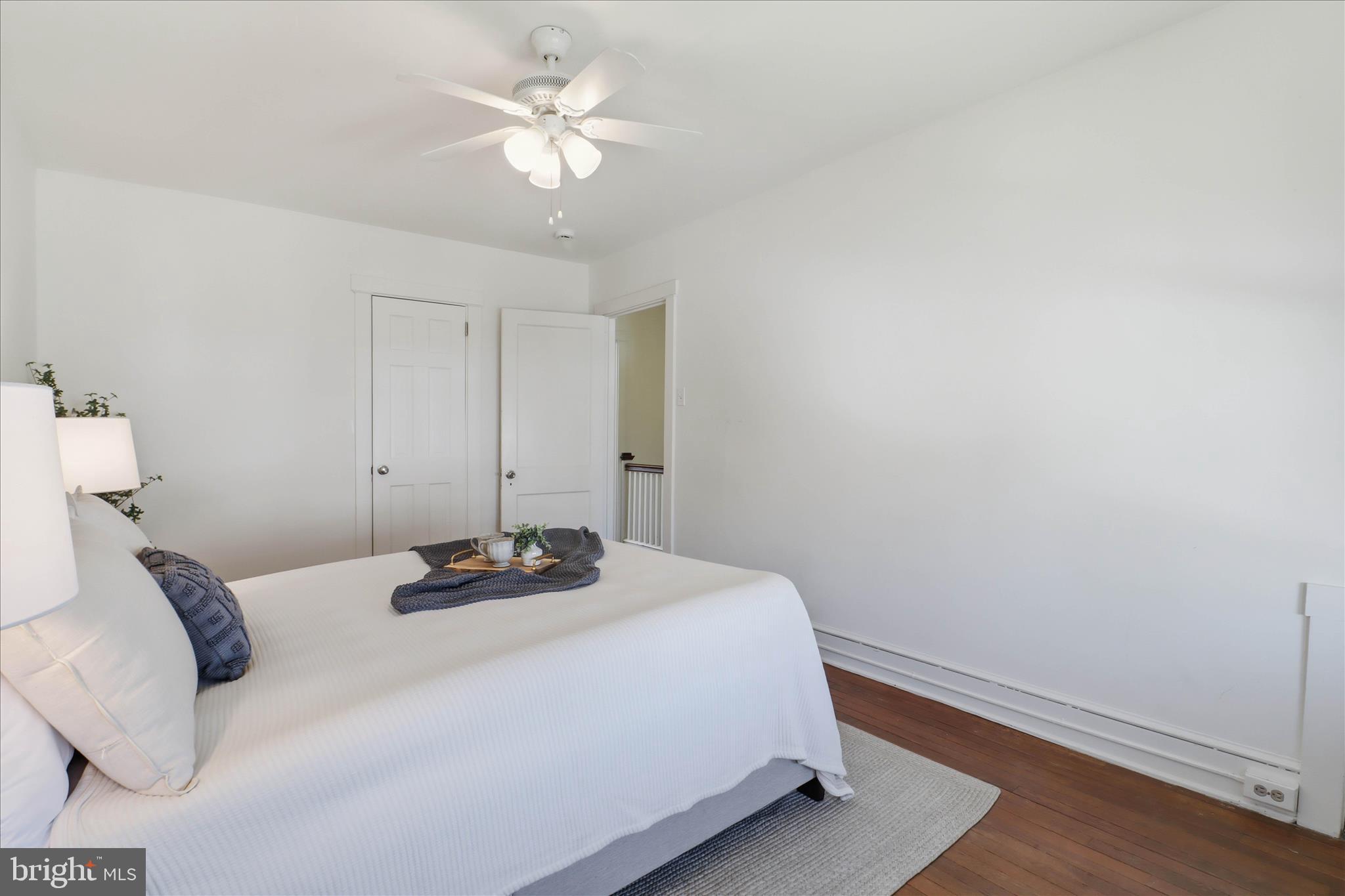 521 Hamilton Street Lancaster, PA 17602 - Photo 22 of 44 a bedroom with a bed and a chandelier