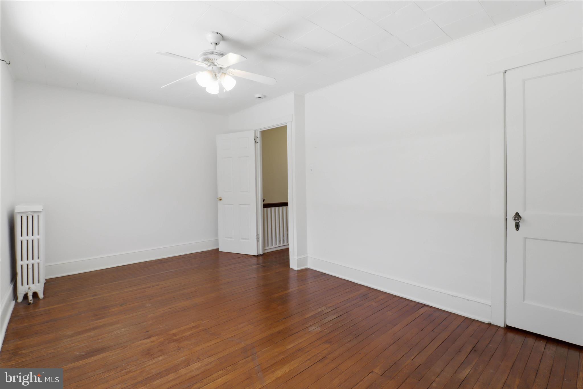 521 Hamilton Street Lancaster, PA 17602 - Photo 25 of 44 a view of an empty room with wooden floor