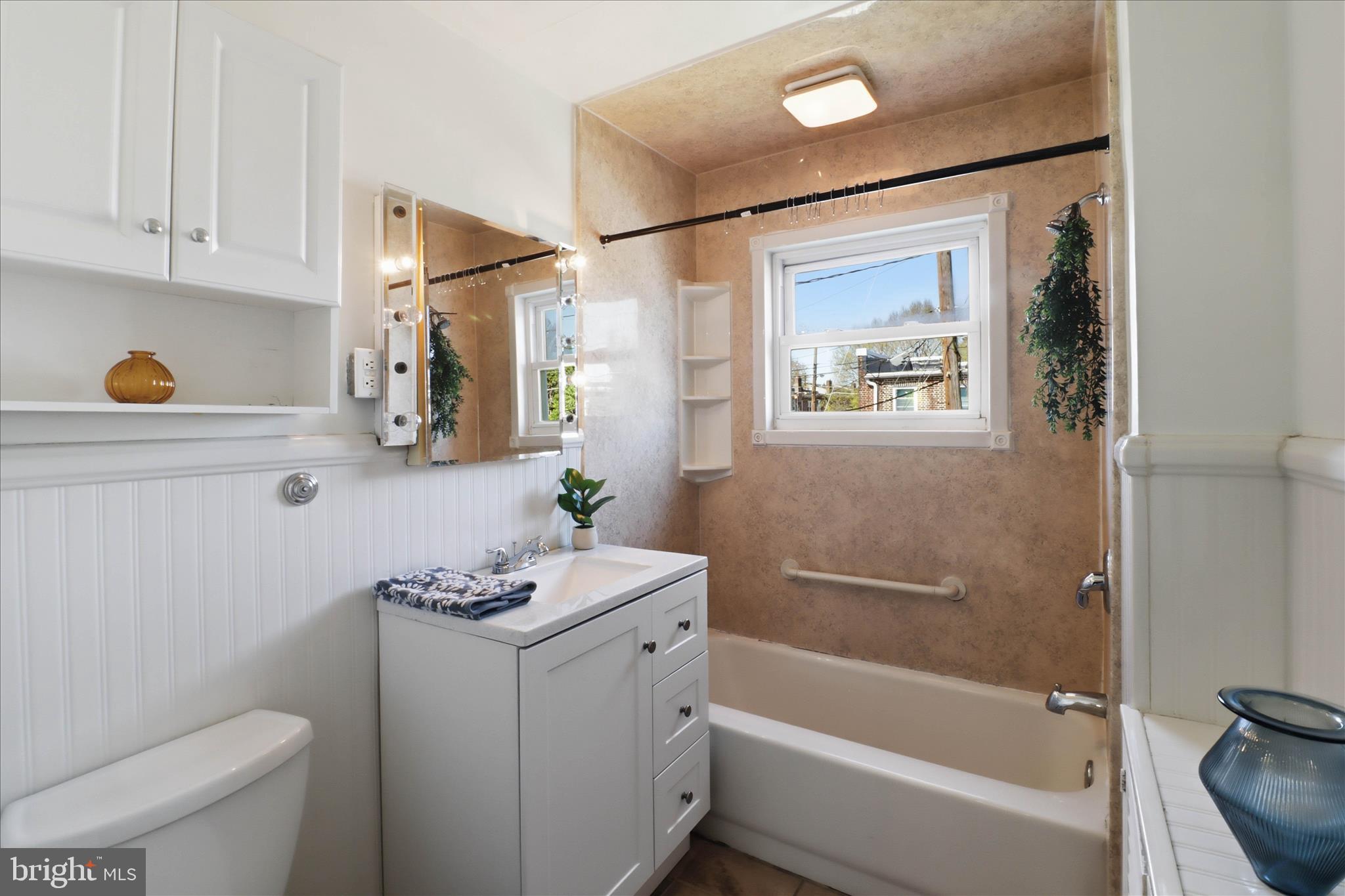 521 Hamilton Street Lancaster, PA 17602 - Photo 27 of 44 a bathroom with a granite countertop sink a toilet and shower