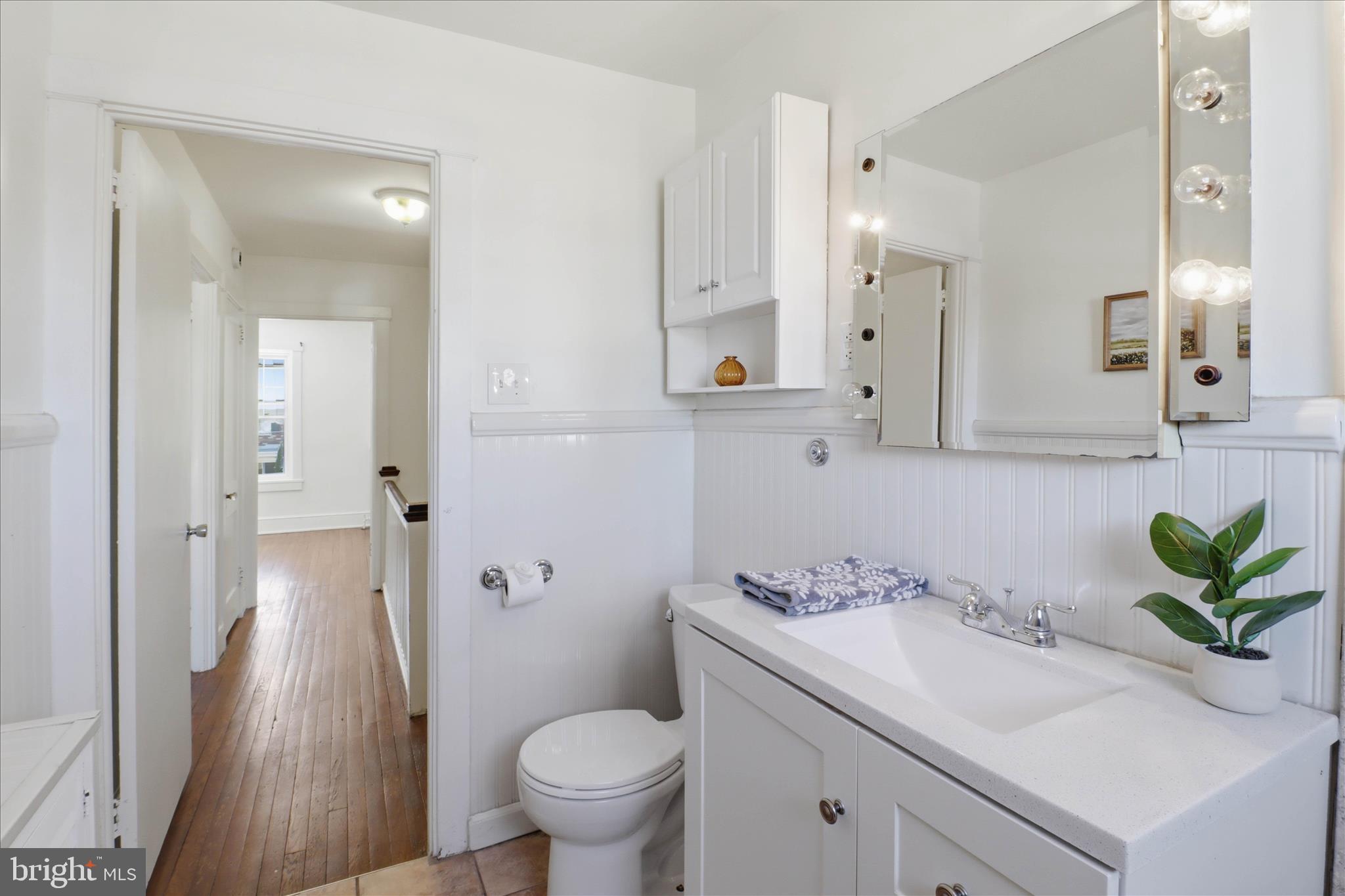 521 Hamilton Street Lancaster, PA 17602 - Photo 28 of 44 a bathroom with a sink a toilet and a mirror
