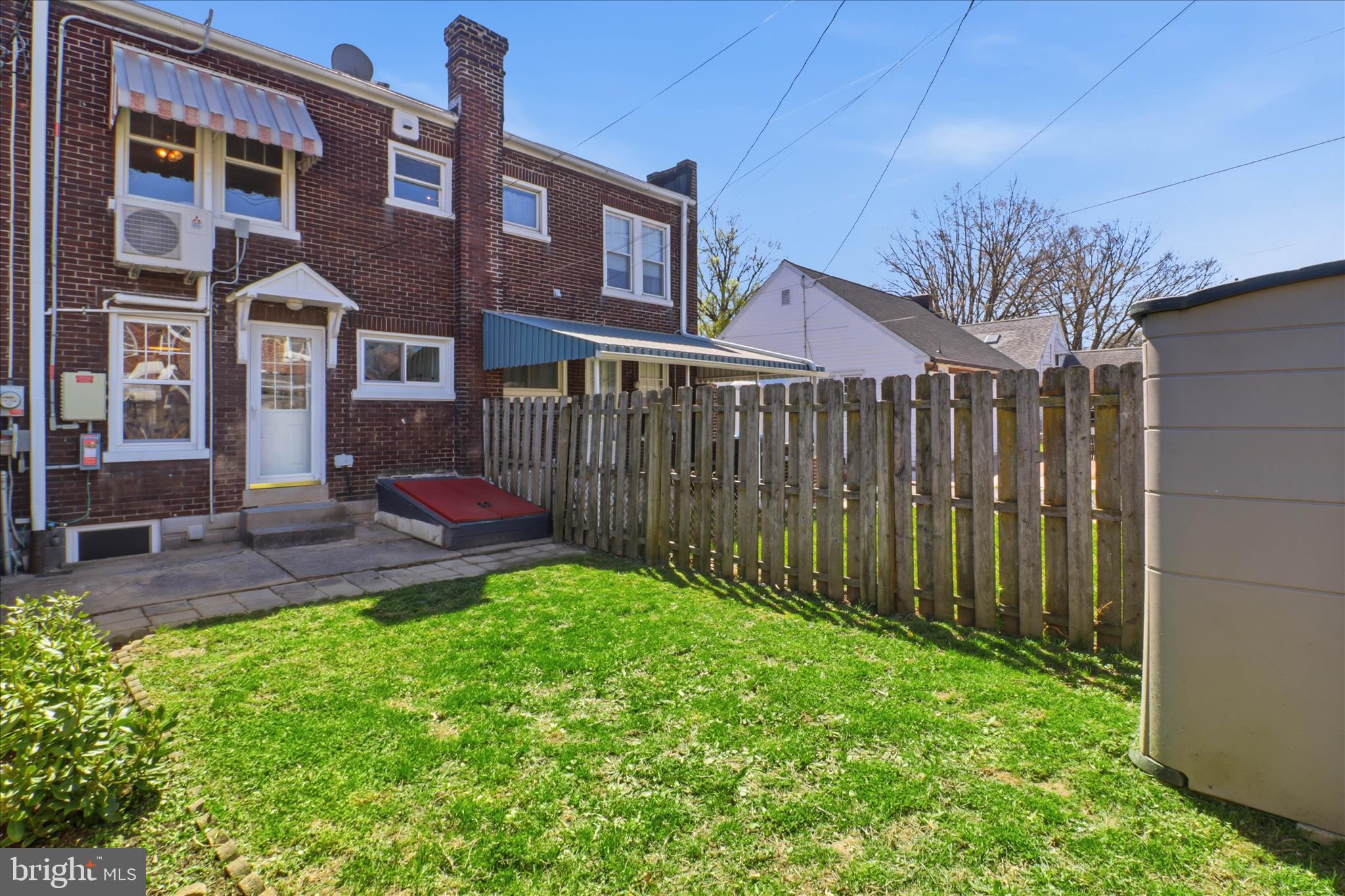 521 Hamilton Street Lancaster, PA 17602 - Photo 38 of 44 a view of a backyard with table and chairs and wooden fence
