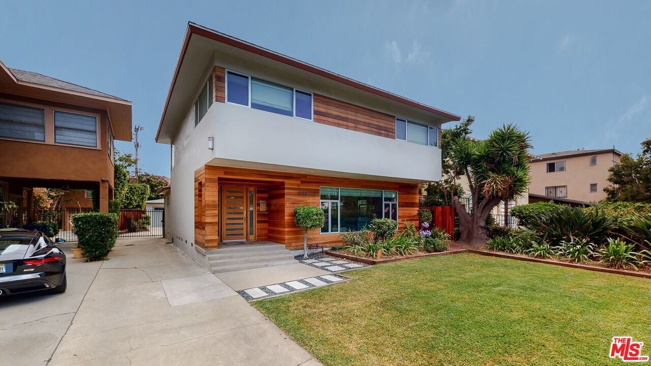 1848 Virginia Road Los Angeles, CA 90019 - Photo 2 of 39 a view of a house with backyard porch and sitting area