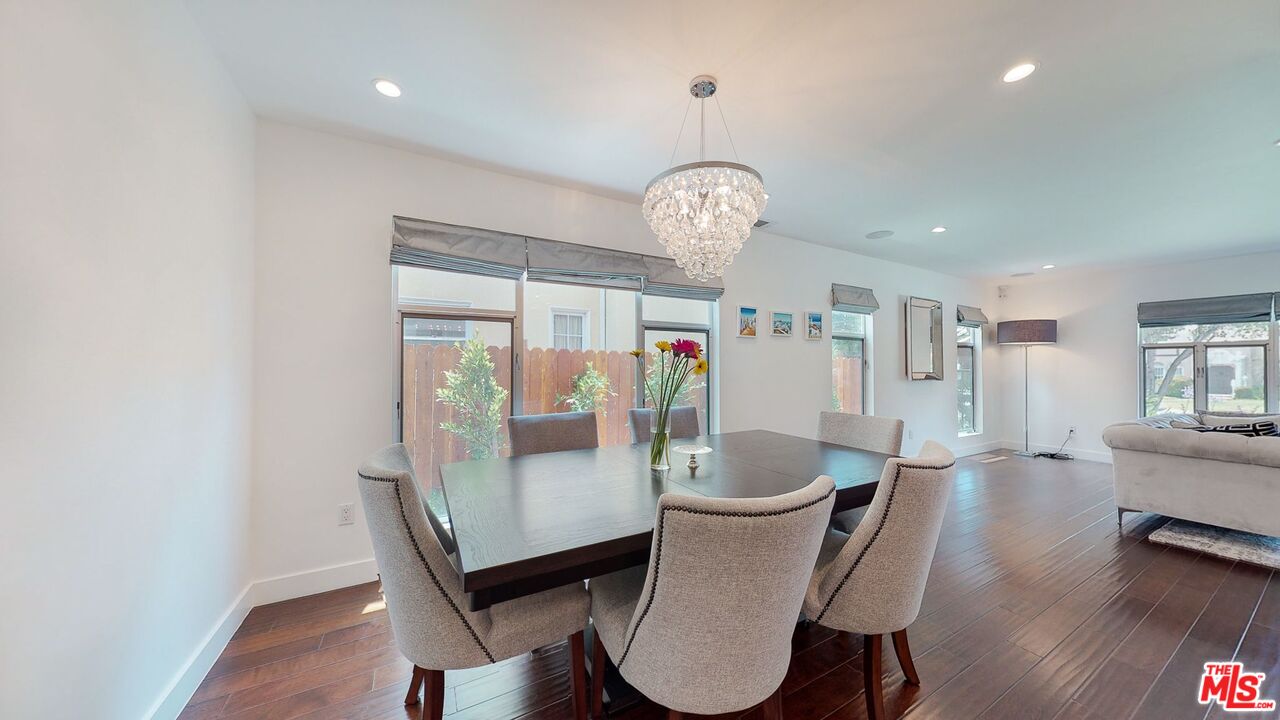 1848 Virginia Road Los Angeles, CA 90019 - Photo 11 of 39 a view of a dining room with furniture wooden floor and chandelier