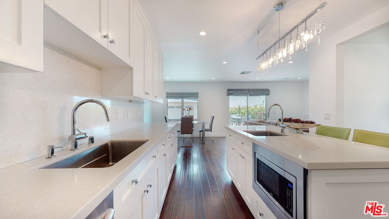 1848 Virginia Road Los Angeles, CA 90019 - Photo 14 of 39 a kitchen with a sink a counter top space and stainless steel appliances