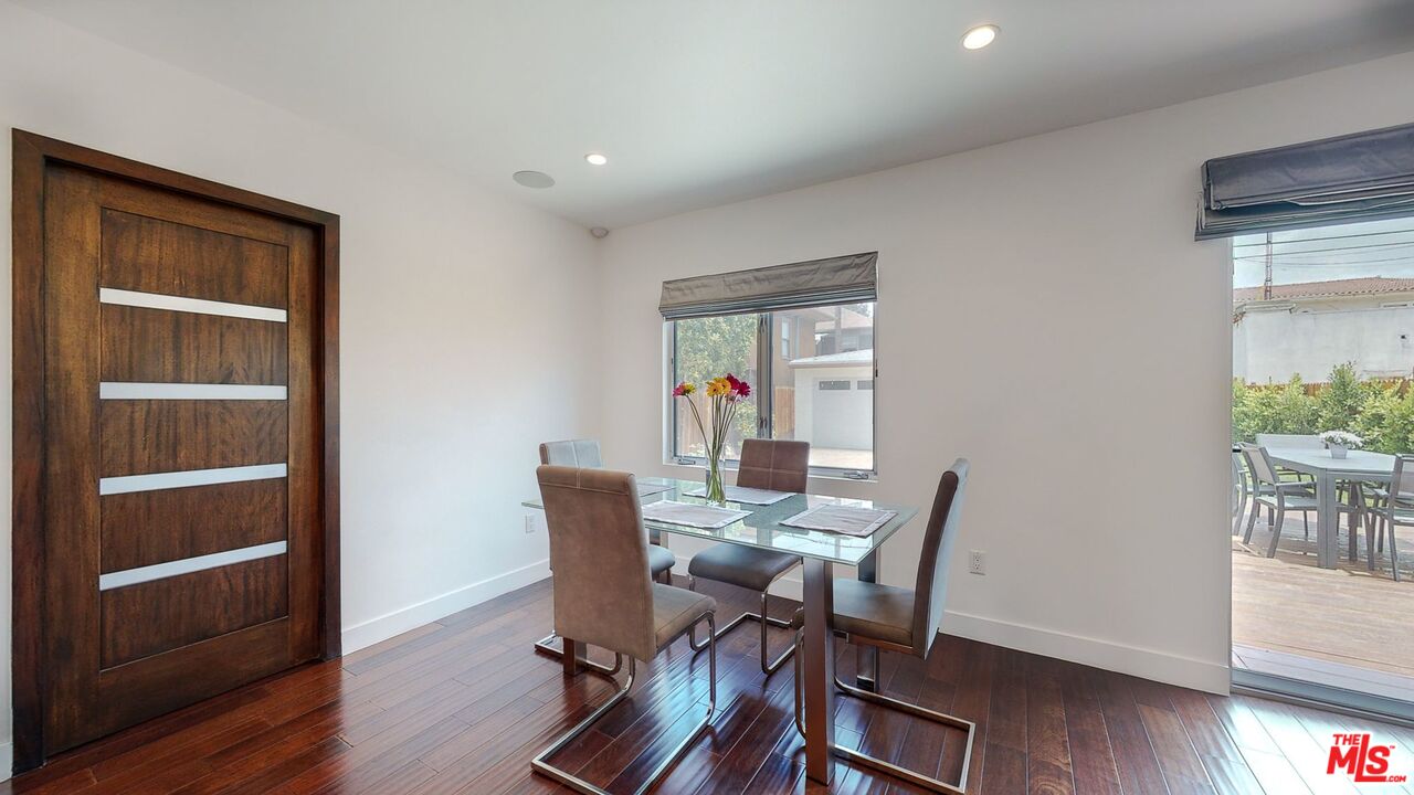 1848 Virginia Road Los Angeles, CA 90019 - Photo 15 of 39 a view of a dining room with furniture and wooden floor