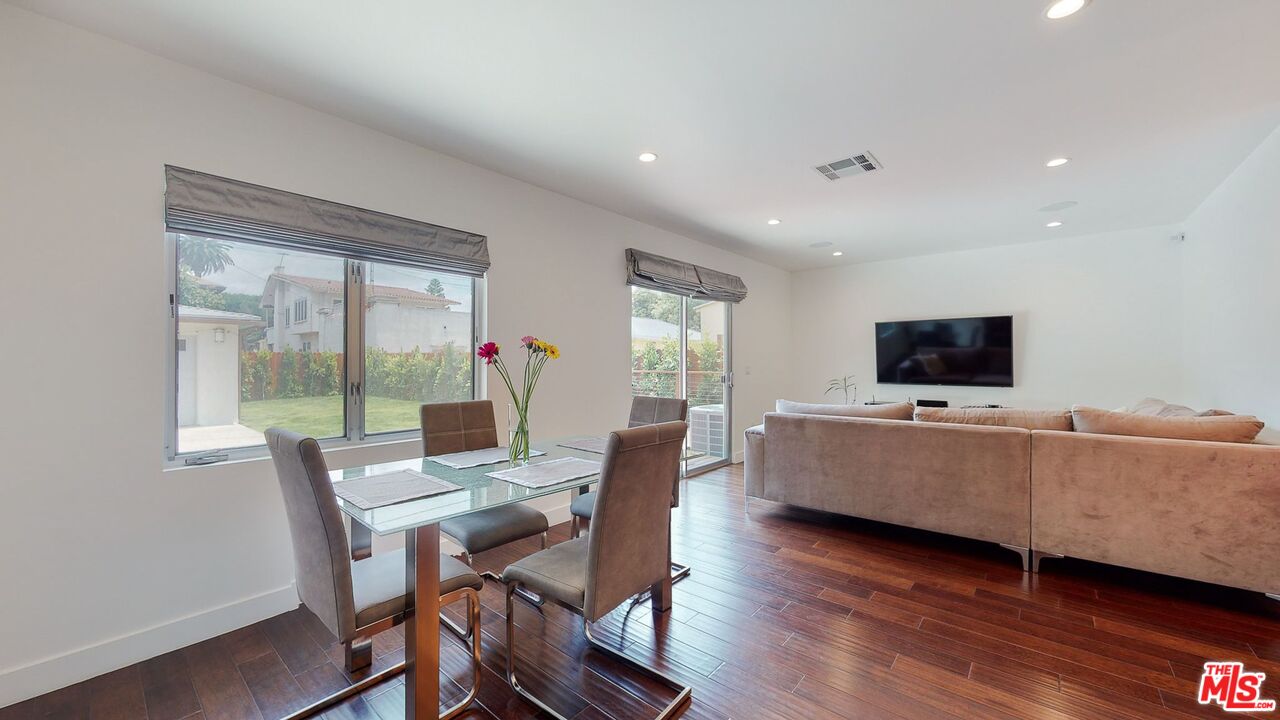 1848 Virginia Road Los Angeles, CA 90019 - Photo 16 of 39 a living room with furniture and a flat screen tv