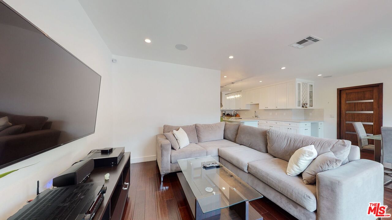 1848 Virginia Road Los Angeles, CA 90019 - Photo 18 of 39 a living room with furniture and a wooden floor