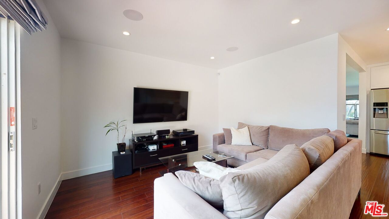 1848 Virginia Road Los Angeles, CA 90019 - Photo 19 of 39 a living room with furniture and a flat screen tv