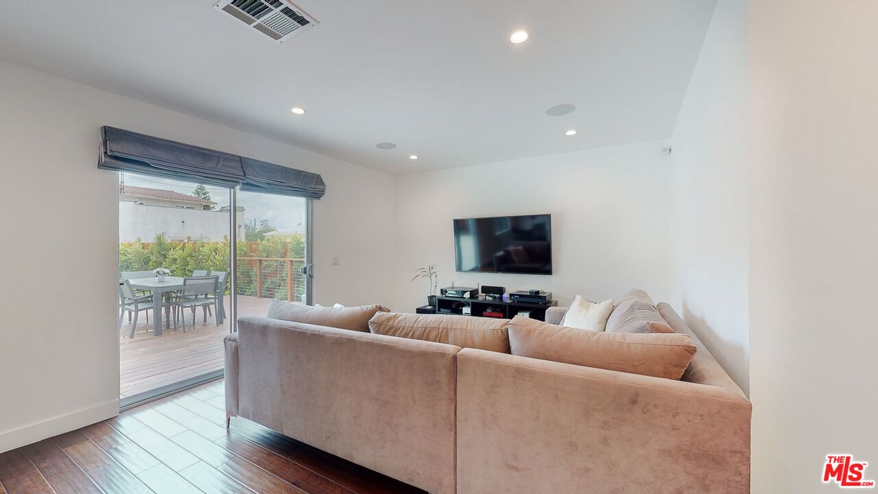 1848 Virginia Road Los Angeles, CA 90019 - Photo 20 of 39 a living room with furniture and a flat screen tv