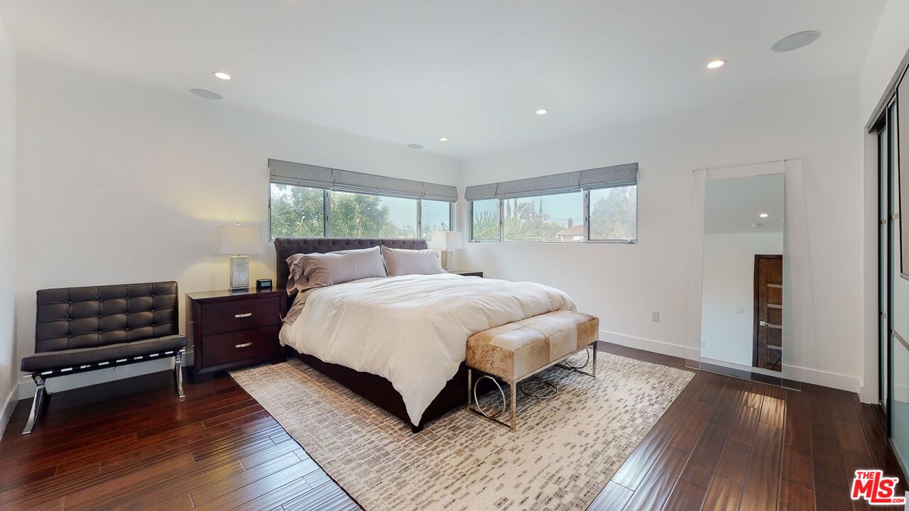 1848 Virginia Road Los Angeles, CA 90019 - Photo 21 of 39 a spacious bedroom with a bed and wooden floor