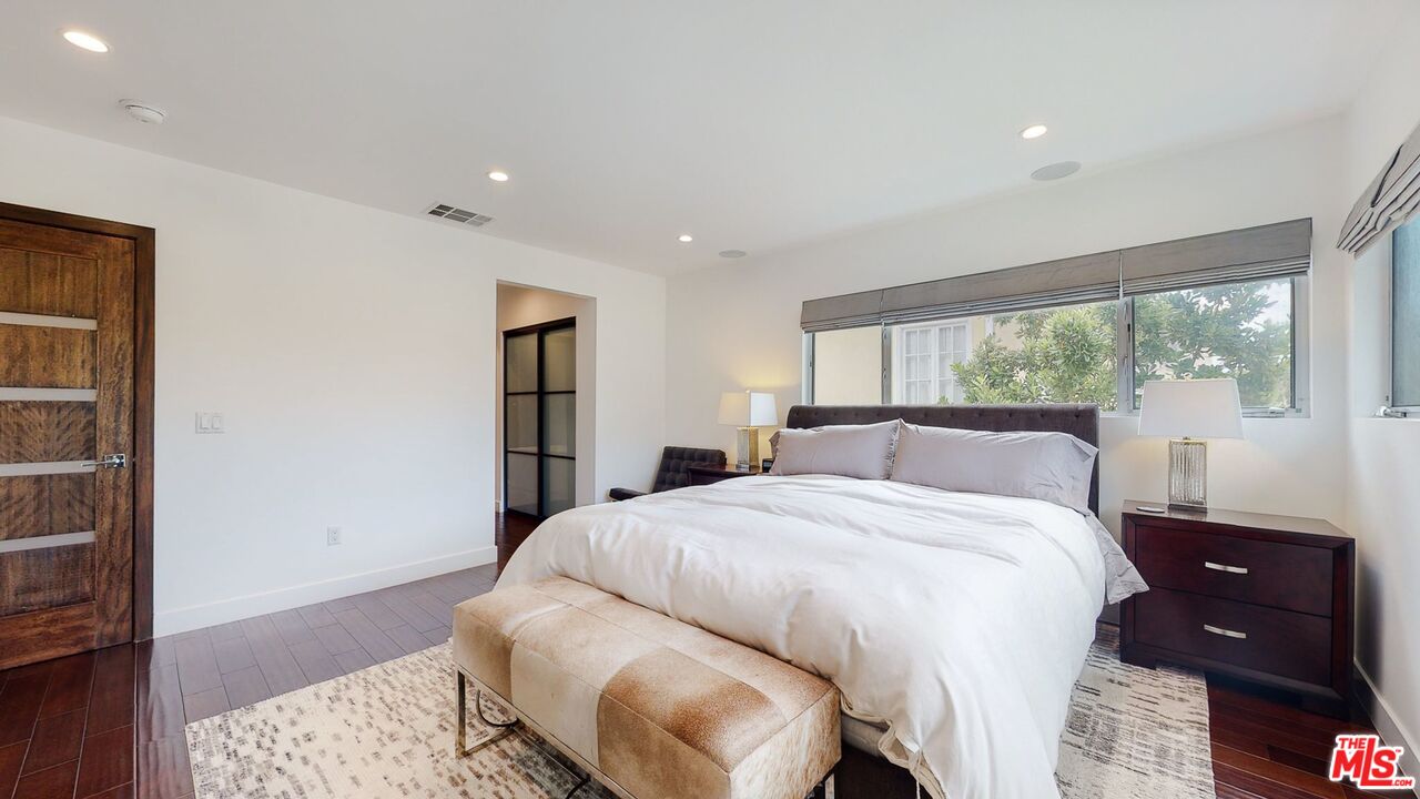 1848 Virginia Road Los Angeles, CA 90019 - Photo 22 of 39 a bedroom with a bed and a night stand