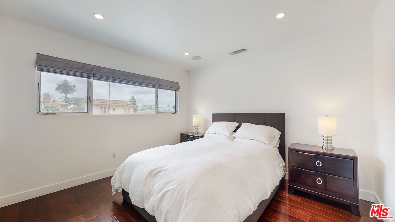 1848 Virginia Road Los Angeles, CA 90019 - Photo 26 of 39 a bedroom with a bed and a window