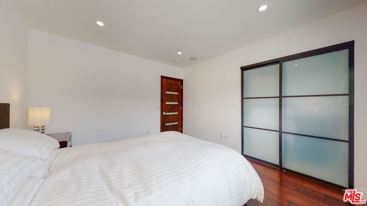 1848 Virginia Road Los Angeles, CA 90019 - Photo 28 of 39 a bedroom with a bed and a closet