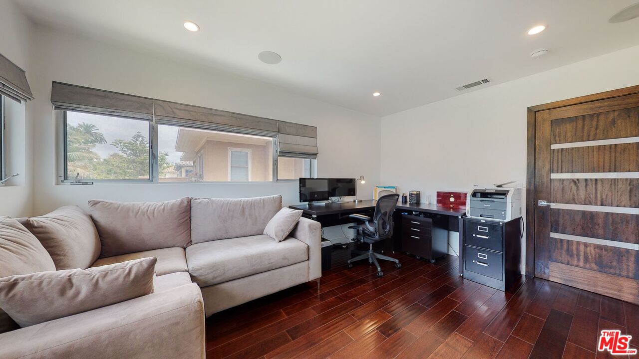 1848 Virginia Road Los Angeles, CA 90019 - Photo 31 of 39 a living room with furniture and a wooden floor