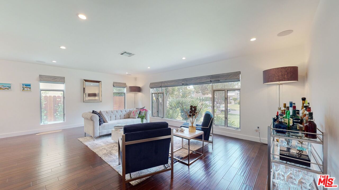 1848 Virginia Road Los Angeles, CA 90019 - Photo 5 of 39 a living room with furniture and wooden floor