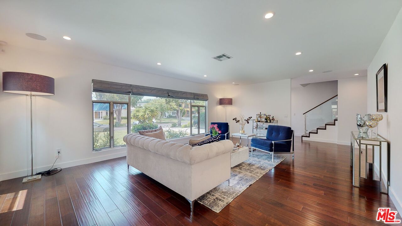 1848 Virginia Road Los Angeles, CA 90019 - Photo 7 of 39 a living room with furniture and a large window