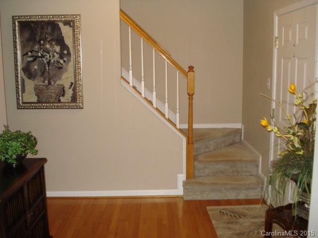 10116 Truitt Court Huntersville, NC 28078 - Photo 2 of 18 a view of staircase with wooden floor and a potted plant