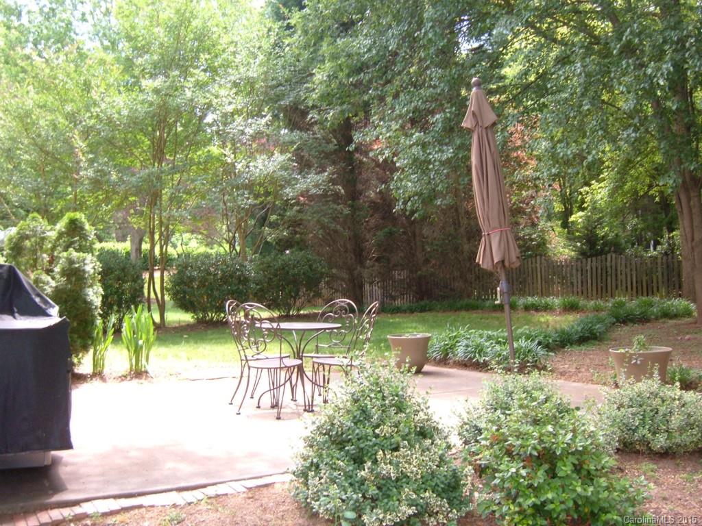 10116 Truitt Court Huntersville, NC 28078 - Photo 17 of 18 a view of backyard with a barn and large trees