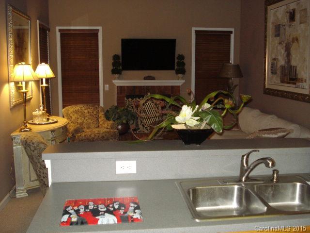 10116 Truitt Court Huntersville, NC 28078 - Photo 3 of 18 a kitchen sink with granite countertop a sink and a stove