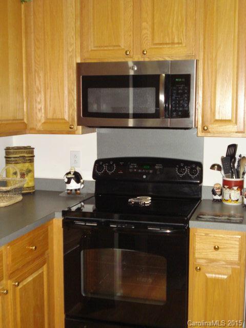 10116 Truitt Court Huntersville, NC 28078 - Photo 8 of 18 a kitchen with a stove and a microwave