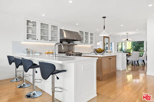 a kitchen with stainless steel appliances lots of counter top space