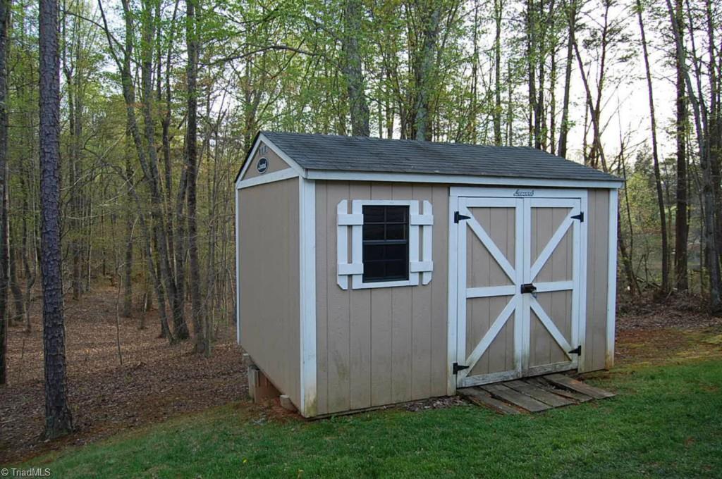 664 Spainhour Road King, NC 27021 - Photo 12 of 12 Storage Building, pond viewable to right.