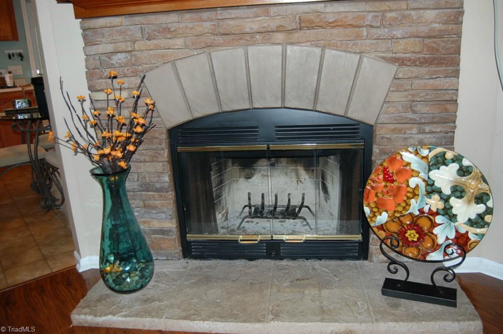 664 Spainhour Road King, NC 27021 - Photo 5 of 12 Living Room wood burning fireplace.