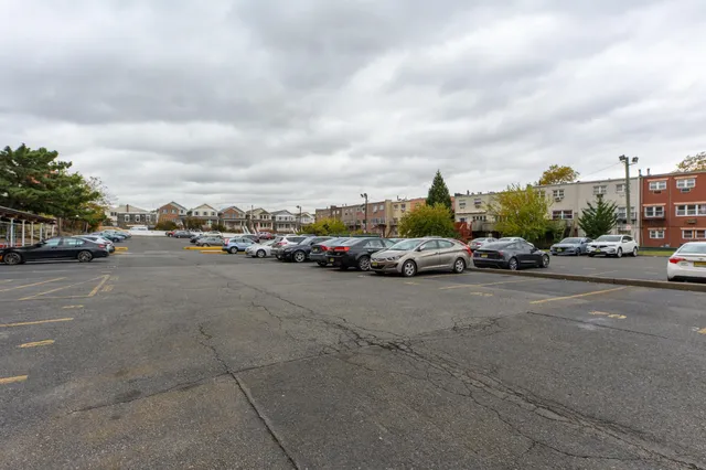 a city street filled with lots of cars and buildings