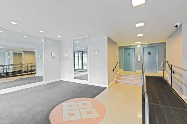 a spacious bathroom with a vanity and a mirror