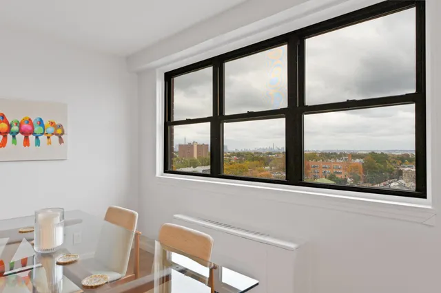 a view of a room that has a large window