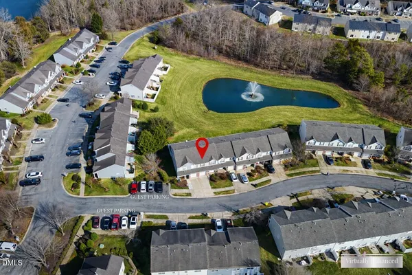an aerial view of a swimming pool patio and outdoor seating
