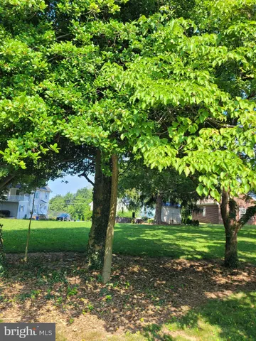 a aerial view of a house with a yard