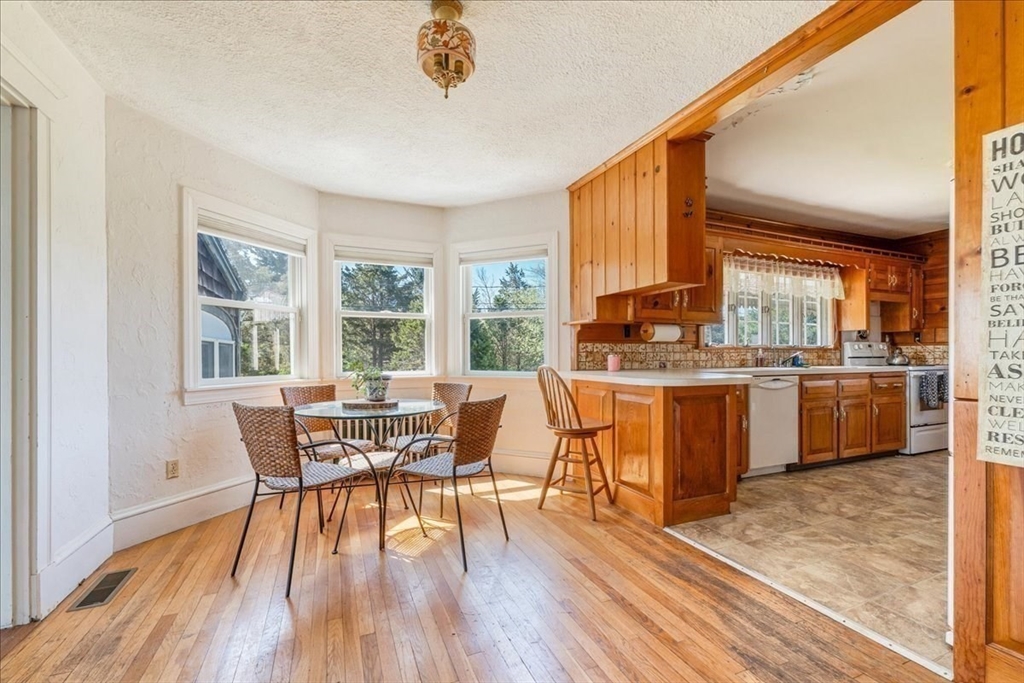 70 Hedge Road Plymouth, MA 02360 - Photo 16 of 41 a dining room with furniture window and wooden floor
