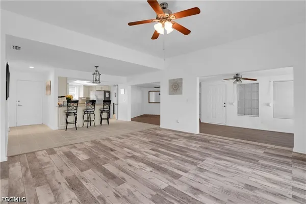a view of a livingroom with a kitchen