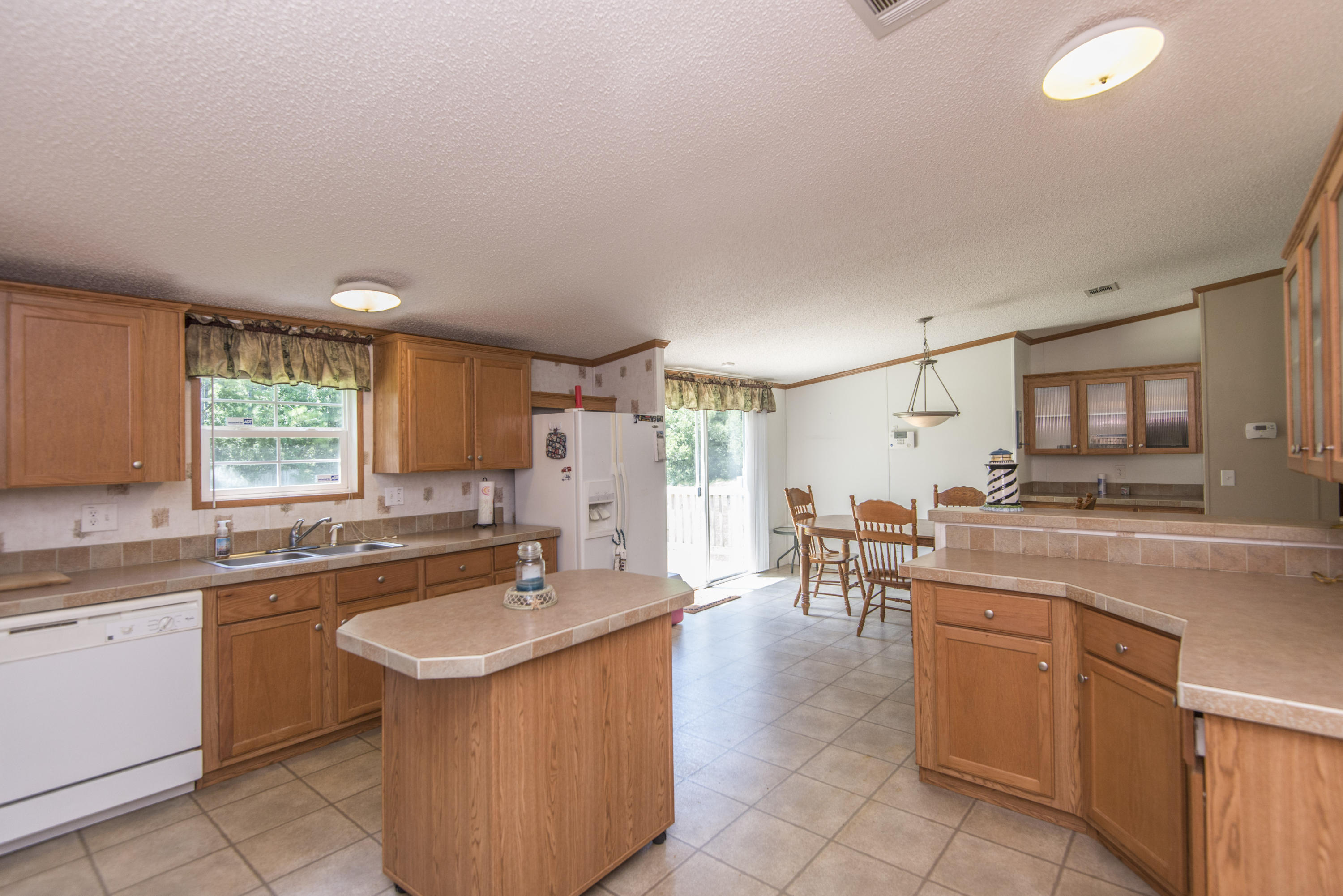 125 Little River Road Goose Creek, SC 29445 - Photo 10 of 33 125littleriverkitchentoreardoor