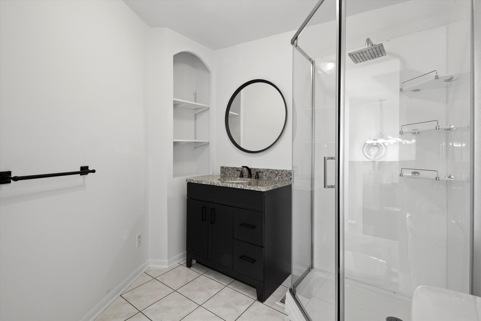 33448 North Greentree Road Grayslake, IL 60030 - Photo 16 of 49 a bathroom with a sink a mirror a vanity and a shower