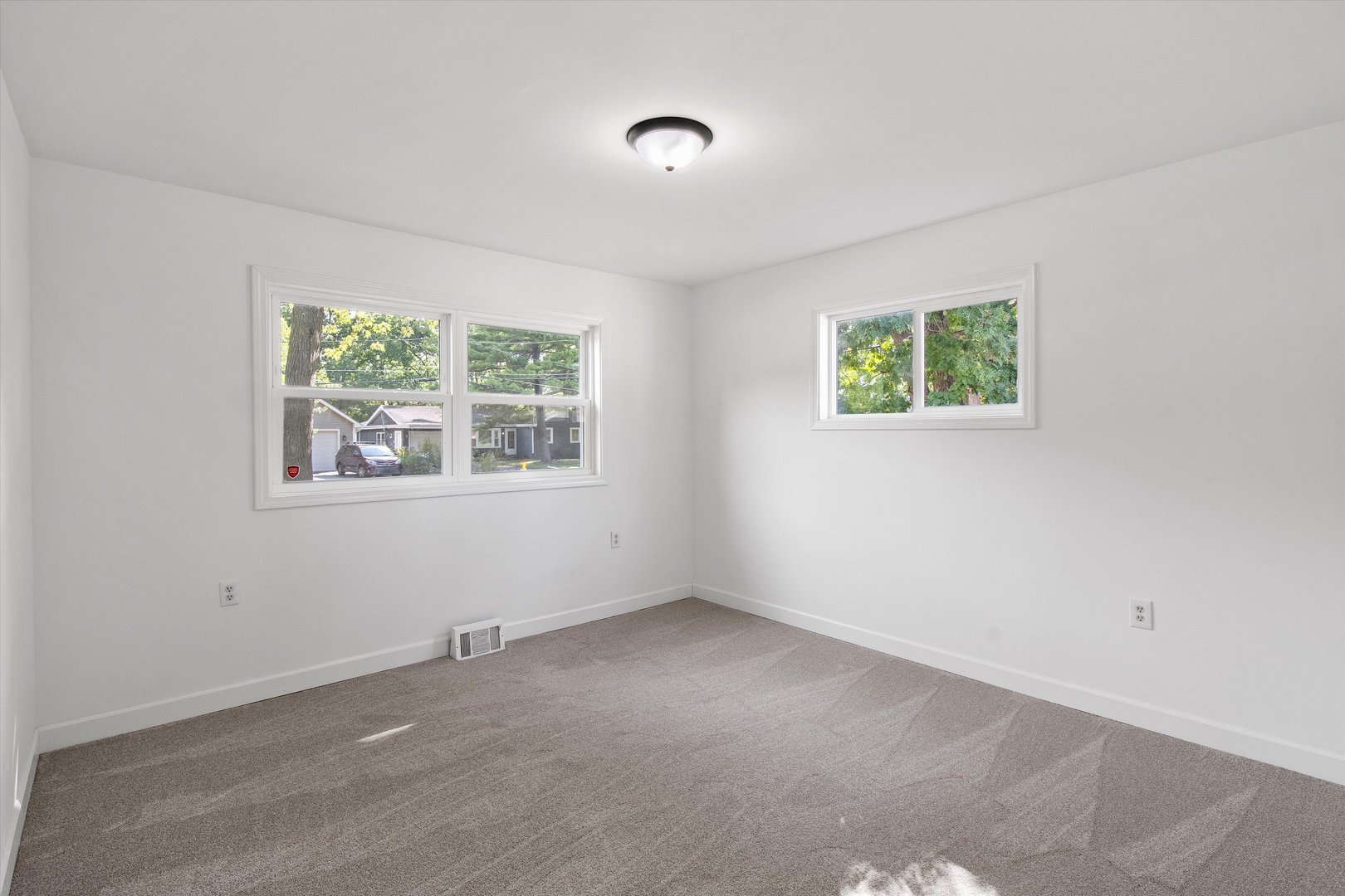 33448 North Greentree Road Grayslake, IL 60030 - Photo 21 of 49 an empty room with windows and ceiling fan