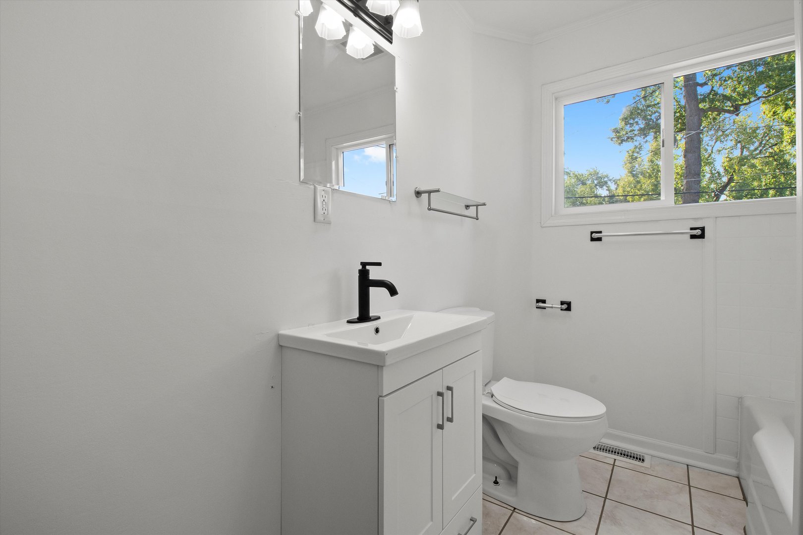 33448 North Greentree Road Grayslake, IL 60030 - Photo 27 of 49 a white toilet sitting next to a bathroom sink