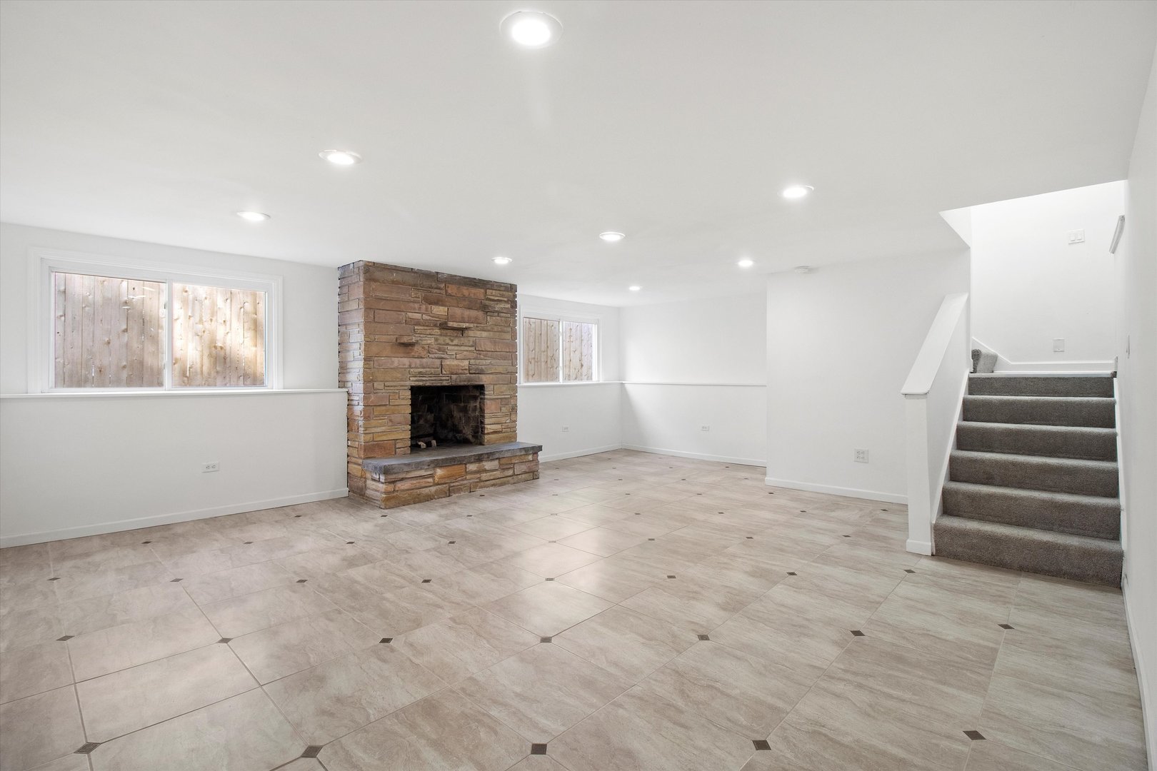 33448 North Greentree Road Grayslake, IL 60030 - Photo 29 of 49 an empty room with wooden floor and fireplace