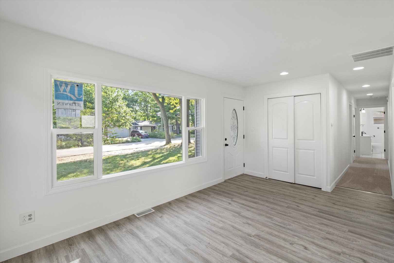 33448 North Greentree Road Grayslake, IL 60030 - Photo 3 of 49 a view of an empty room with wooden floor and a window