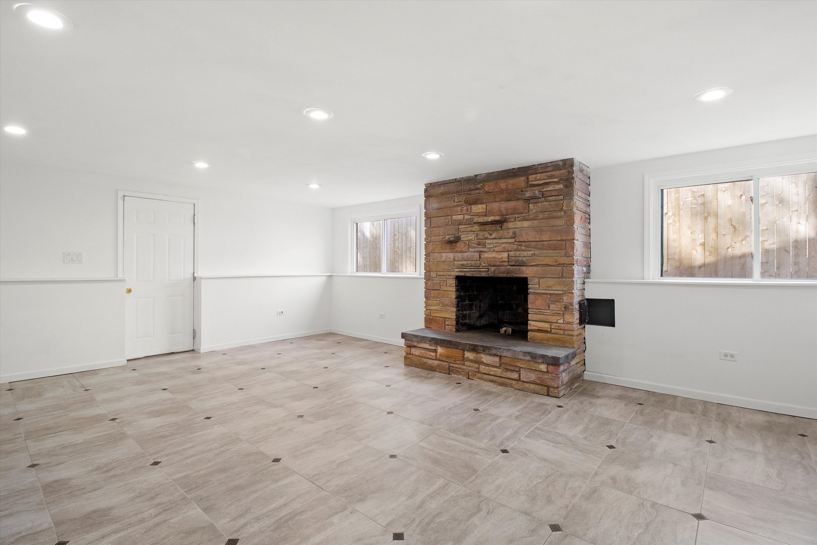 33448 North Greentree Road Grayslake, IL 60030 - Photo 32 of 49 a view of empty room with a fireplace and window