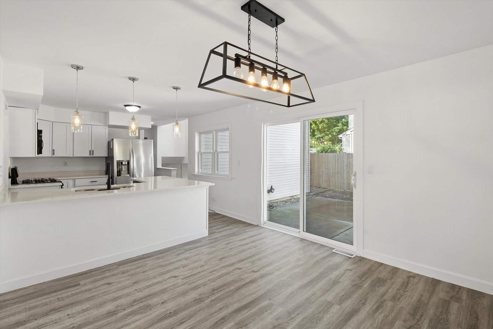 33448 North Greentree Road Grayslake, IL 60030 - Photo 6 of 49 a view of a kitchen with a sink stainless steel appliances and cabinets