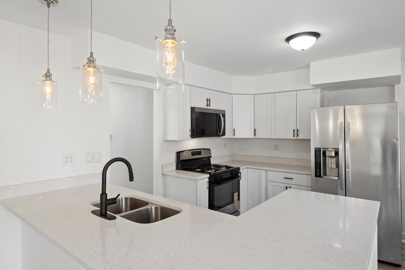 33448 North Greentree Road Grayslake, IL 60030 - Photo 10 of 49 a kitchen with stainless steel appliances a sink a stove a refrigerator and cabinets