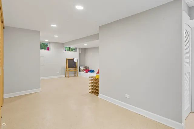 a backyard of a house with lots of green space and a bench
