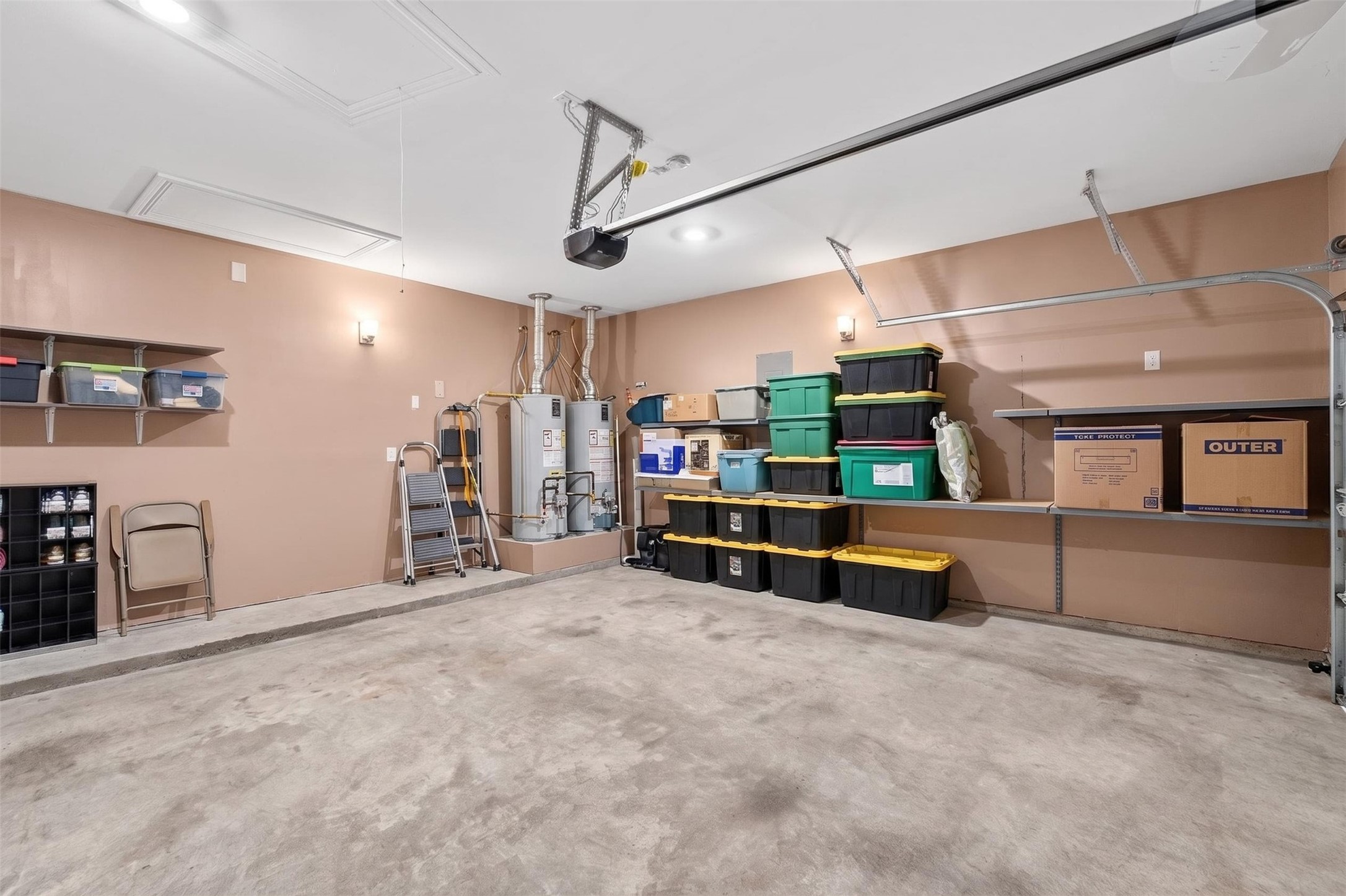 2832 Mistygate Court Conroe, TX 77301 - Photo 32 of 50 Large garage with a garage door opener featuring plenty of space for additional storage.