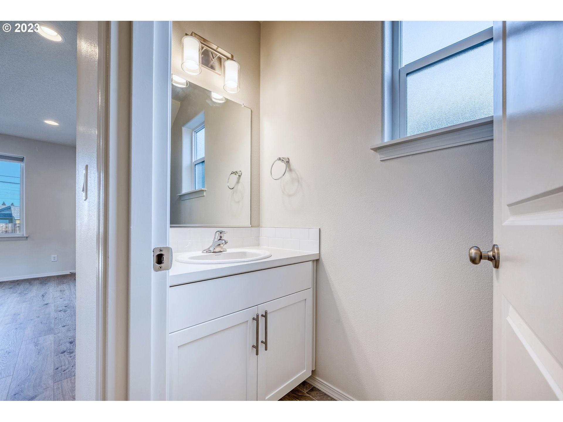 1057 Laura Street Springfield, OR 97477 - Photo 14 of 39 a bathroom with a sink and a mirror
