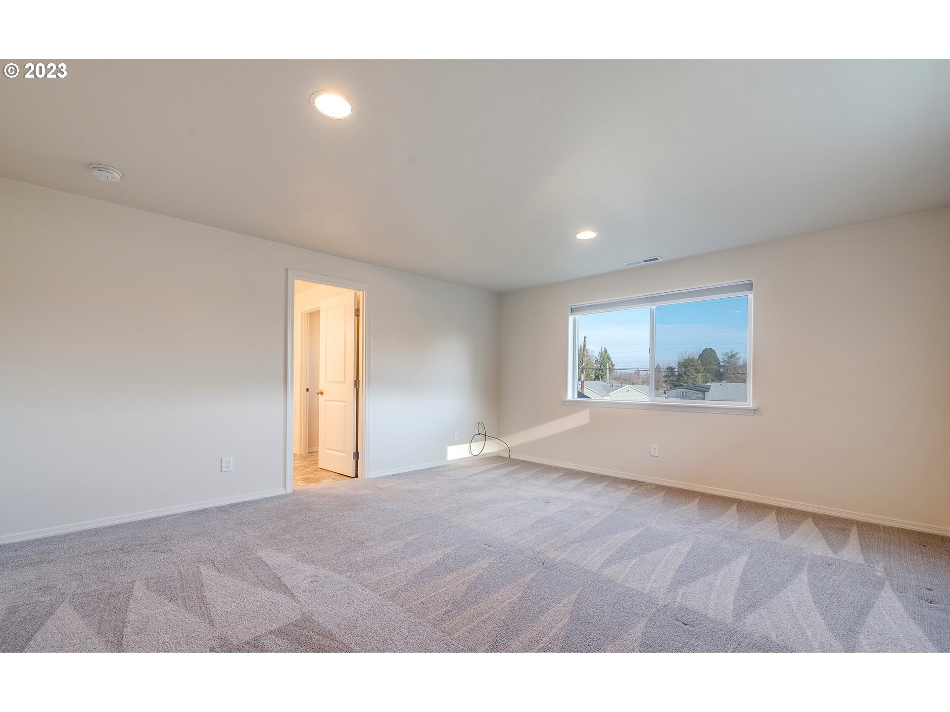 1057 Laura Street Springfield, OR 97477 - Photo 20 of 39 a view of an empty room with a window