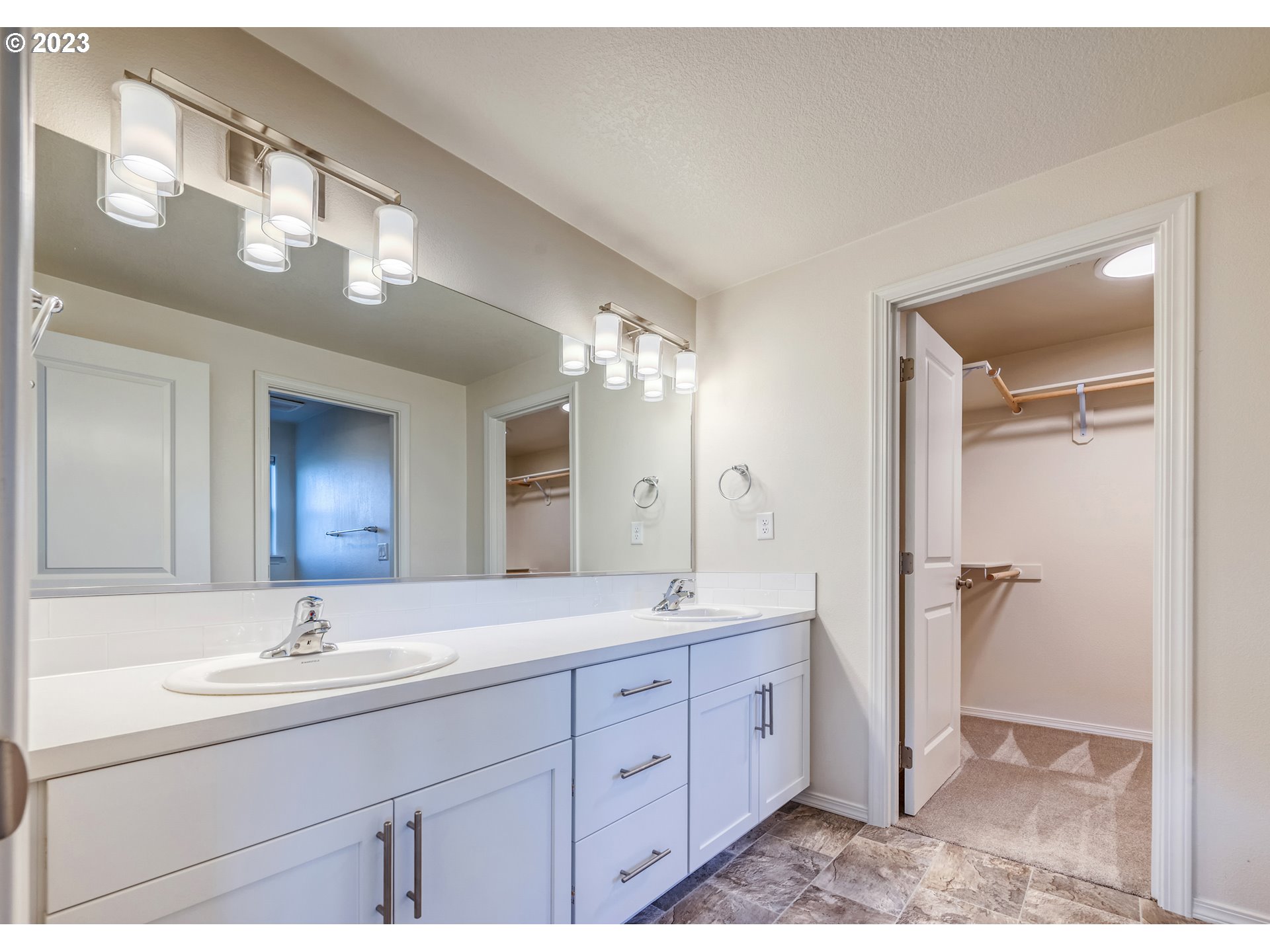 1057 Laura Street Springfield, OR 97477 - Photo 21 of 39 a spacious bathroom with a double vanity sink mirror and double